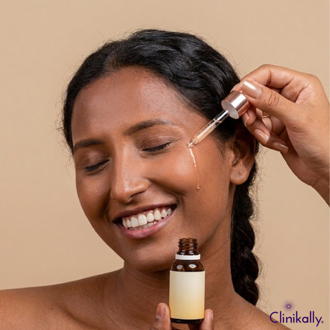 Woman applying Vitamin C face serum with dropper