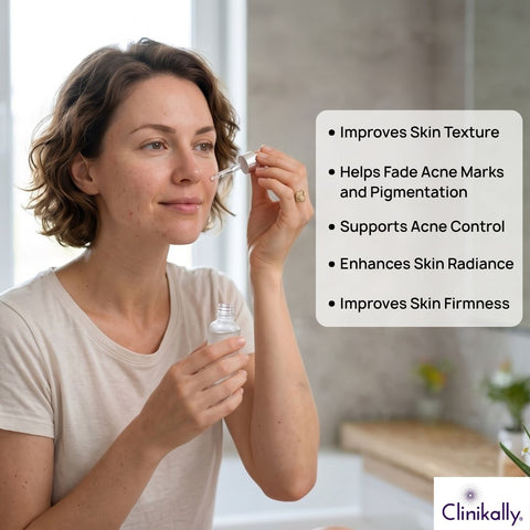 Woman applying retinol serum on face