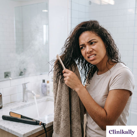 Women combing wet wavy hair