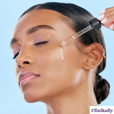 A close-up side profile of a woman applying skin serum drops