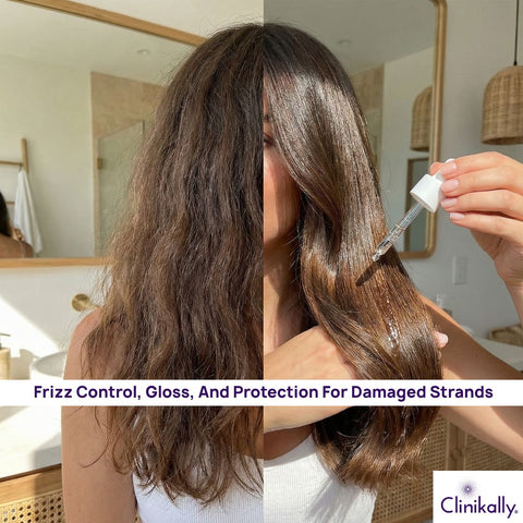 Woman applying oil to fix frizzy hair