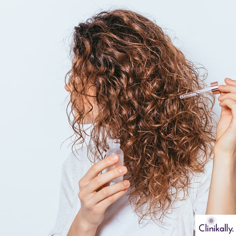 women applying minoxidil hair serum