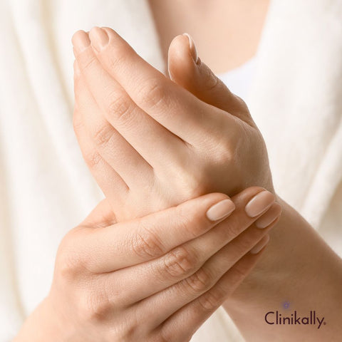 Applying shea butter to dry hands