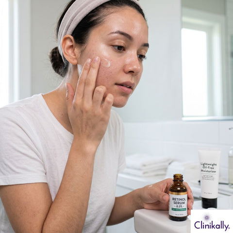 Applying retinol serum with moisturizer