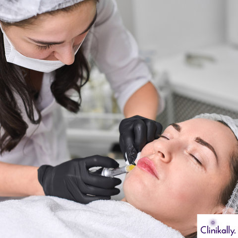 Doctor treating patient with acne scars