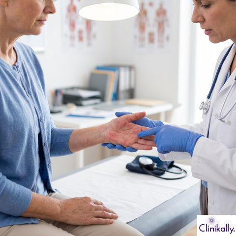 Doctor checking patient with palmar erythema symptoms
