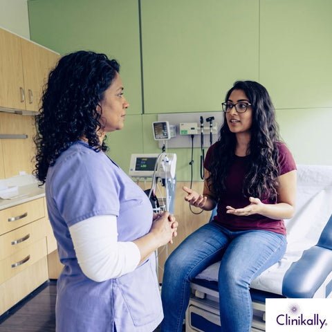 PMOS consultation between doctor and young woman in clinic