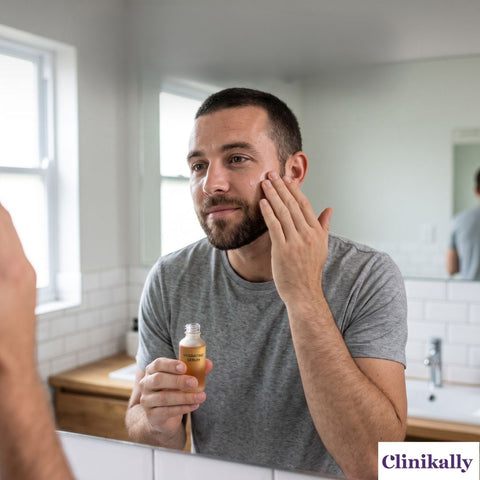 men applying serum on his face